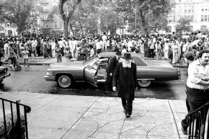 Neighbors stop to watch the Rebbe arrive at 770 Eastern Parkway, circa summer 1977.