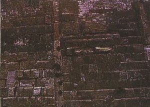 (Plate #4) The vertical line in the center of the photo is the seam, marking the point from which Herod extended the Eastern Wall.  The stones to the lower left of the seam are typical Herodian ashlars.  The stones to the right of the seam pre-date Herod and are the oldest Temple stones that can be seen. 