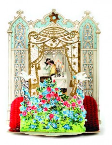 A mother blesses her daughter after lighting the Shabbat candles.