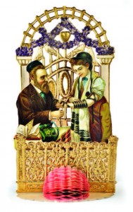 Teaching a bar mitzvah boy how to lay tefillin. 