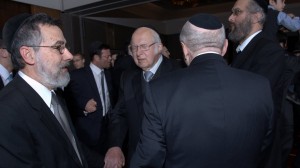 Har Etzion dinner held in New York City in 2013 where Rav Aharon was honored on his 80th birthday. Pictured dancing are Rabbi Menachem Genack (far left), Rav Aharon (middle), and Rav Aharon's son Rabbi Yitzchok Lichtenstein. Courtesy of Yeshivat Har Etzion.